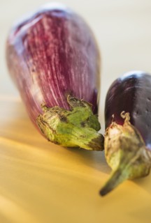 Studio Shot of two eggplants. Photo : Daniel Grill
