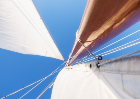 Low angle view of yacht sails and mast. Photo : Daniel Grill