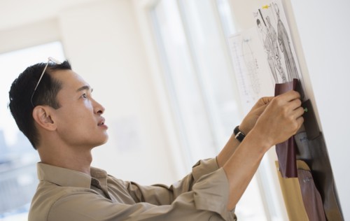 Mid adult fashion designer at work. Photo : Daniel Grill