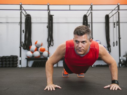 Mature man doing push-ups.