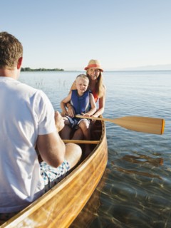 Portrait of young woman with son (4-5) canoe traveling.