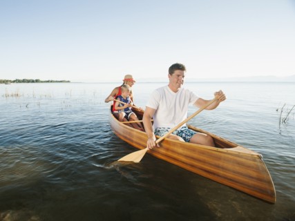 Family with son (4-5) canoe traveling.