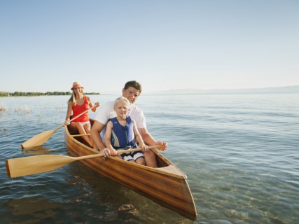 Portrait of family with son (4-5) canoe traveling.