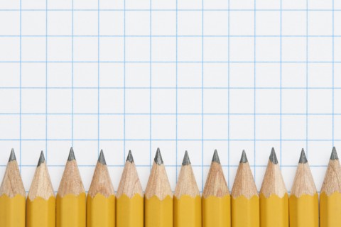 Row of sharpened pencils on graph paper, studio shot. Photo: Kristin Duvall