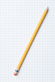 Single yellow sharpened pencil on graph paper. Photo : Kristin Duvall