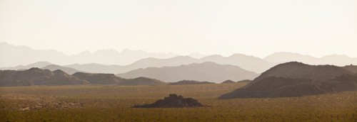 Several mountain ranges backlit by morning sun. Photo: Mike Kemp
