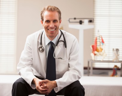 Portrait of doctor smiling. Photo : Mike Kemp
