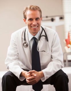 Portrait of doctor smiling. Photo : Mike Kemp