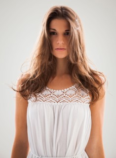 Beautiful woman staring into camera. Photo : Mike Kemp