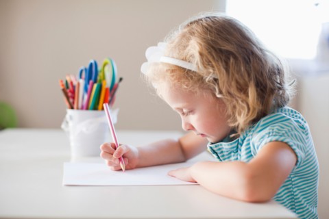 Girl drawing with colours. Photo: Jessica Peterson
