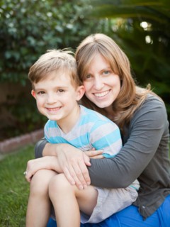 Portrait of mother holding her son (6-7). Photo : Jessica Peterson