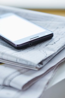 Smartphone on newspaper.