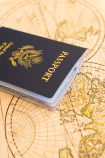 Passport sitting on antique map.