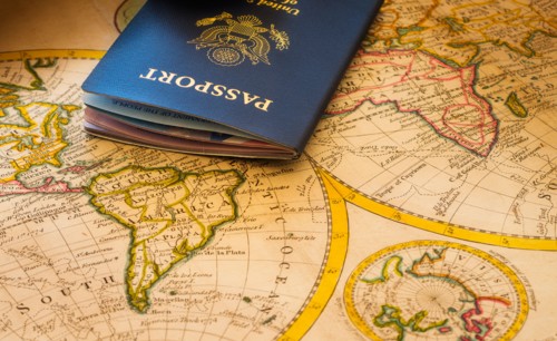 Passport sitting on antique map.
