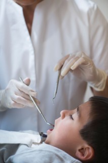 Boy (6-7) at dentist's.