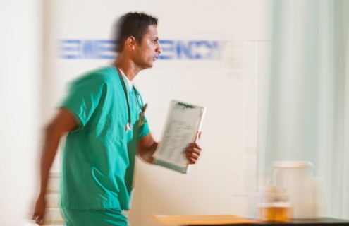 Surgeon entering emergency room.