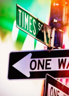 Directional signs at night. New York City, New York.
