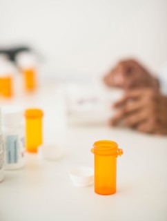 Pharmacist preparing prescription pills.