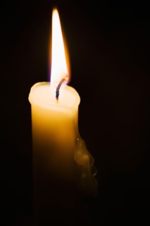 Studio shot of burning candle.
