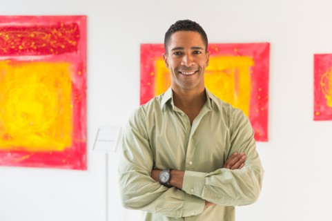 Portrait of man in modern art gallery.