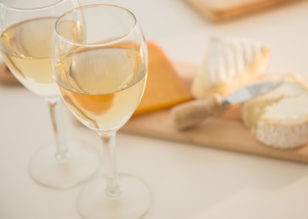 Studio shot of cheese on chopping board