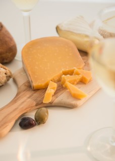 Studio shot of cheese on chopping board