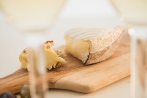 Studio shot of cheese on chopping board
