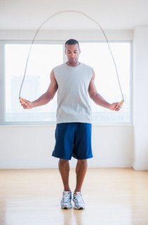 Young man skipping rope