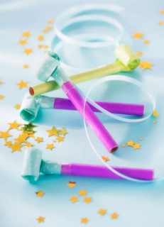 Studio shot of party blowers and confetti