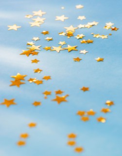 Studio shot of confetti spilled on table