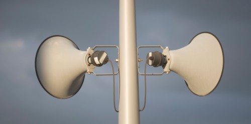 Megaphone against grey sky