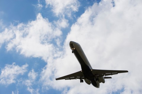 Low angle view of flying airplane