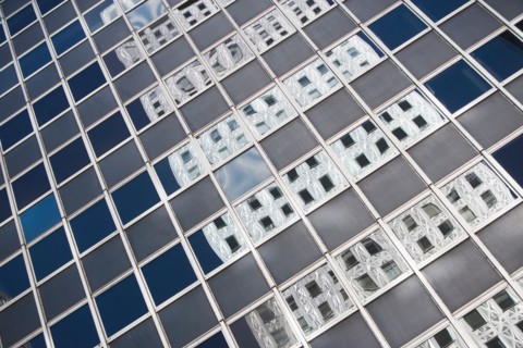 Chrysler building reflecting in glass building