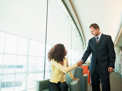 Man and woman greeting in lobby