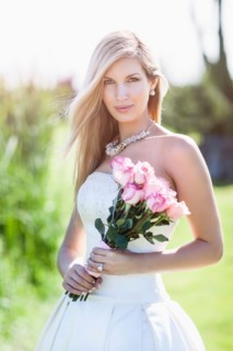 Portrait of bride holding bouquet