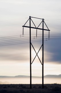 Power lines and tower at sunset