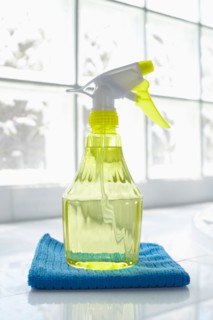 Cleaning supplies in front of glass brick wall