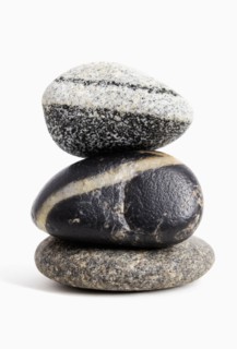 Studio shot of stack of three stones white background