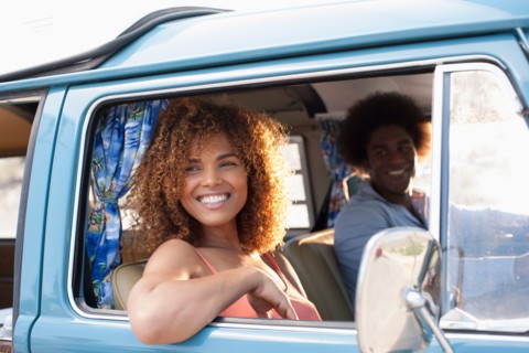 Smiling woman and man in van