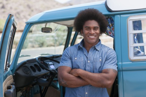 Portrait of man standing at van