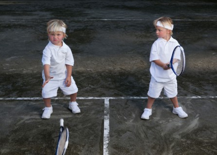 Two boys (2-3) playing tennis