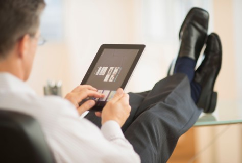 Man using tablet pc.