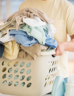 Man carrying laundry basket.