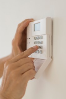 Hand setting code on burglar alarm.