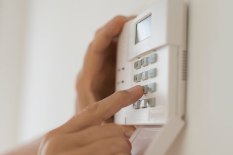 Hand setting code on burglar alarm.