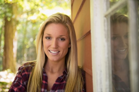 Portrait of young woman standing in front of house. Photo: Jamie Grill