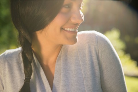 Smiling woman outdoors. Photo: Jamie Grill