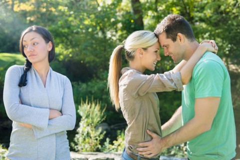 Couple and unhappy woman in forest. Photo : Jamie Grill