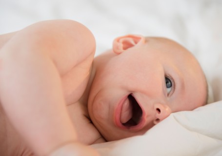 Baby boy (2-5 months) laughing. Photo : Jamie Grill