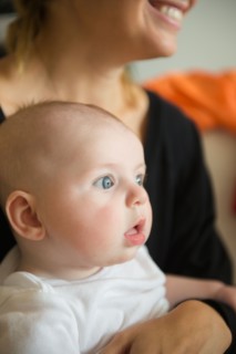 Baby boy (2-5 months) held by mother. Photo: Jamie Grill